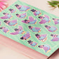 Large sticker sheet of digital illustrated cartoon pigeons wearing top hats and bow ties in various poses and expressions