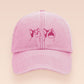 A pink baseball cap hat with an embroidered cute pink Popcat meme cat design.