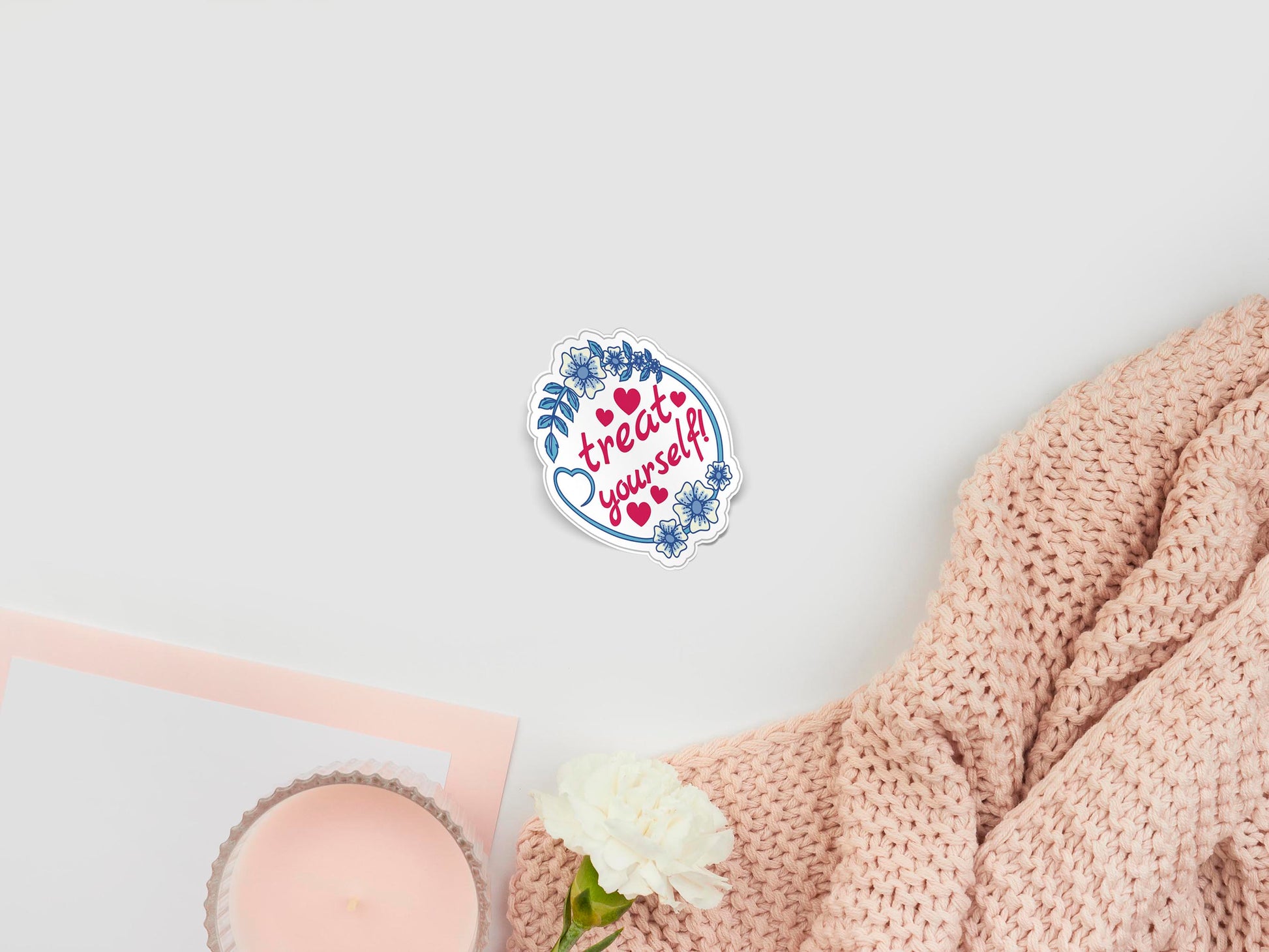 Large sticker of digital illustration cartoon of red text that reads Treat Yourself, surrounded by red love hearts and a blue and white flower frame