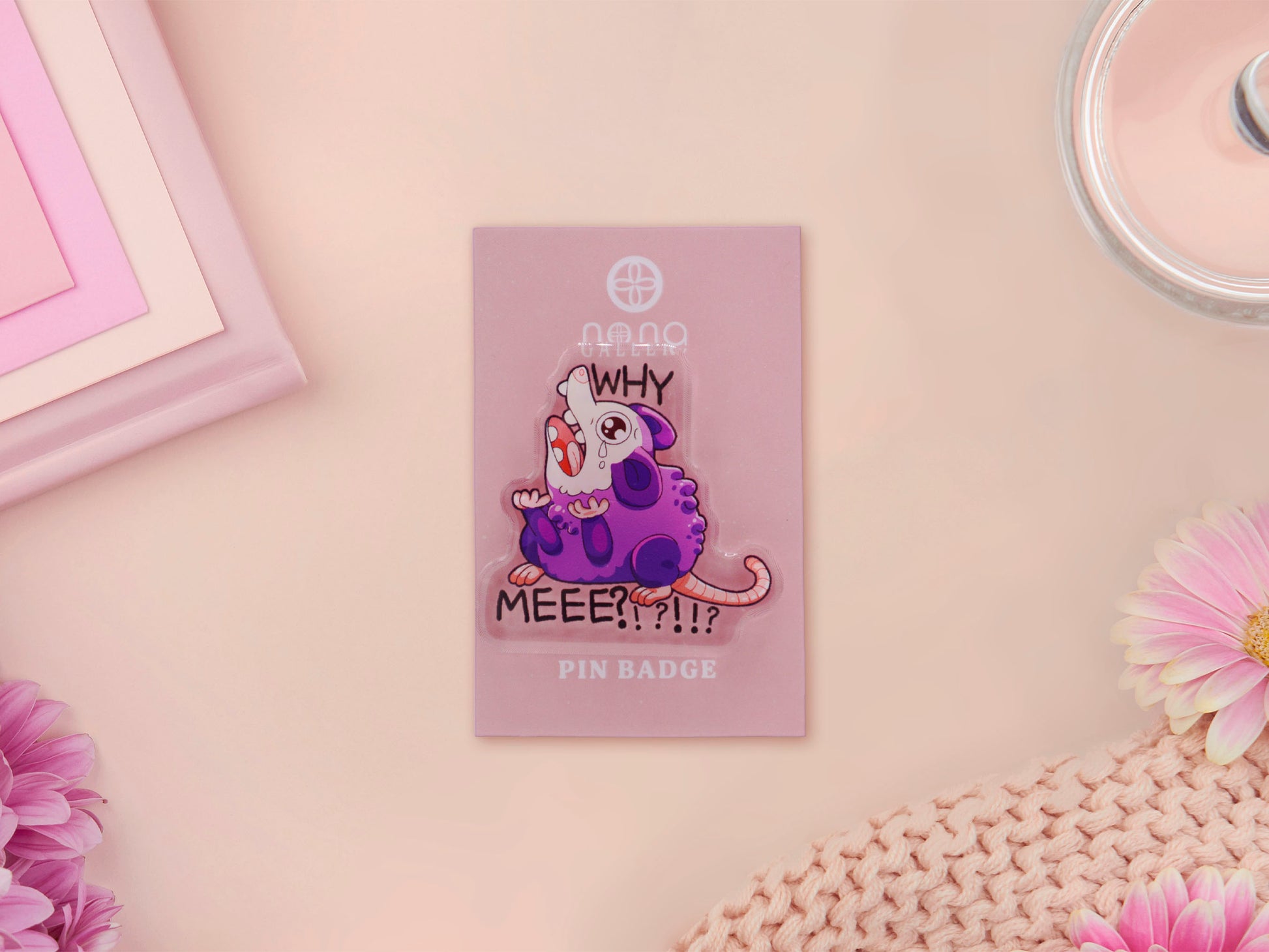 Acrylic pin badge on backing card of a crying and screaming possum with the text why me?!