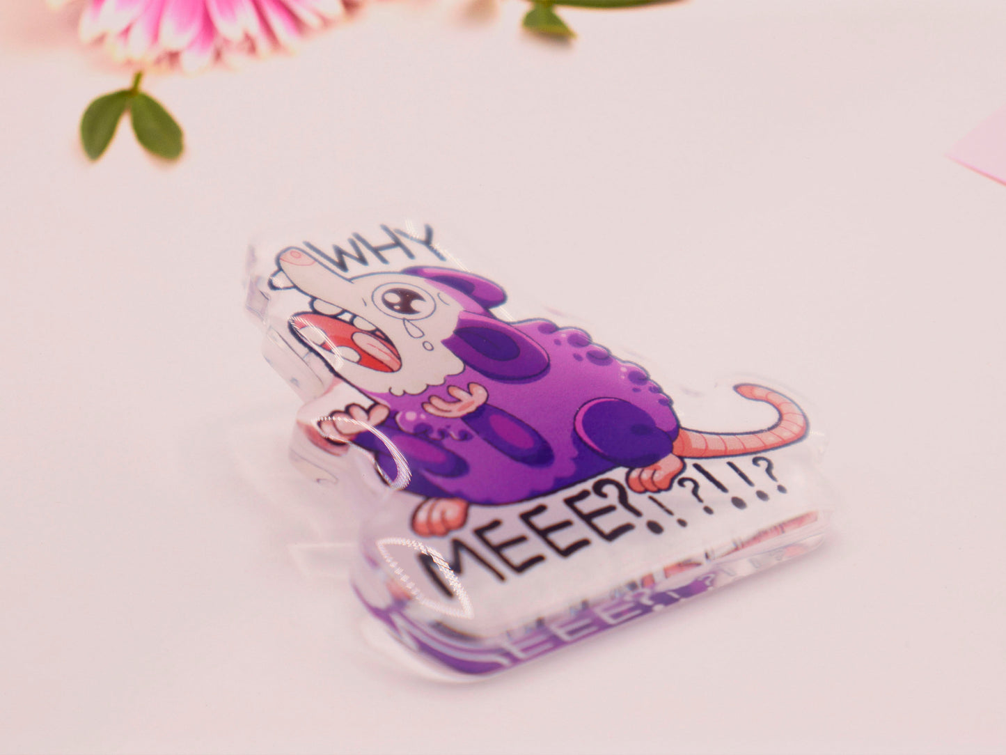 Acrylic pin badge of a crying and screaming possum with the text why me?!