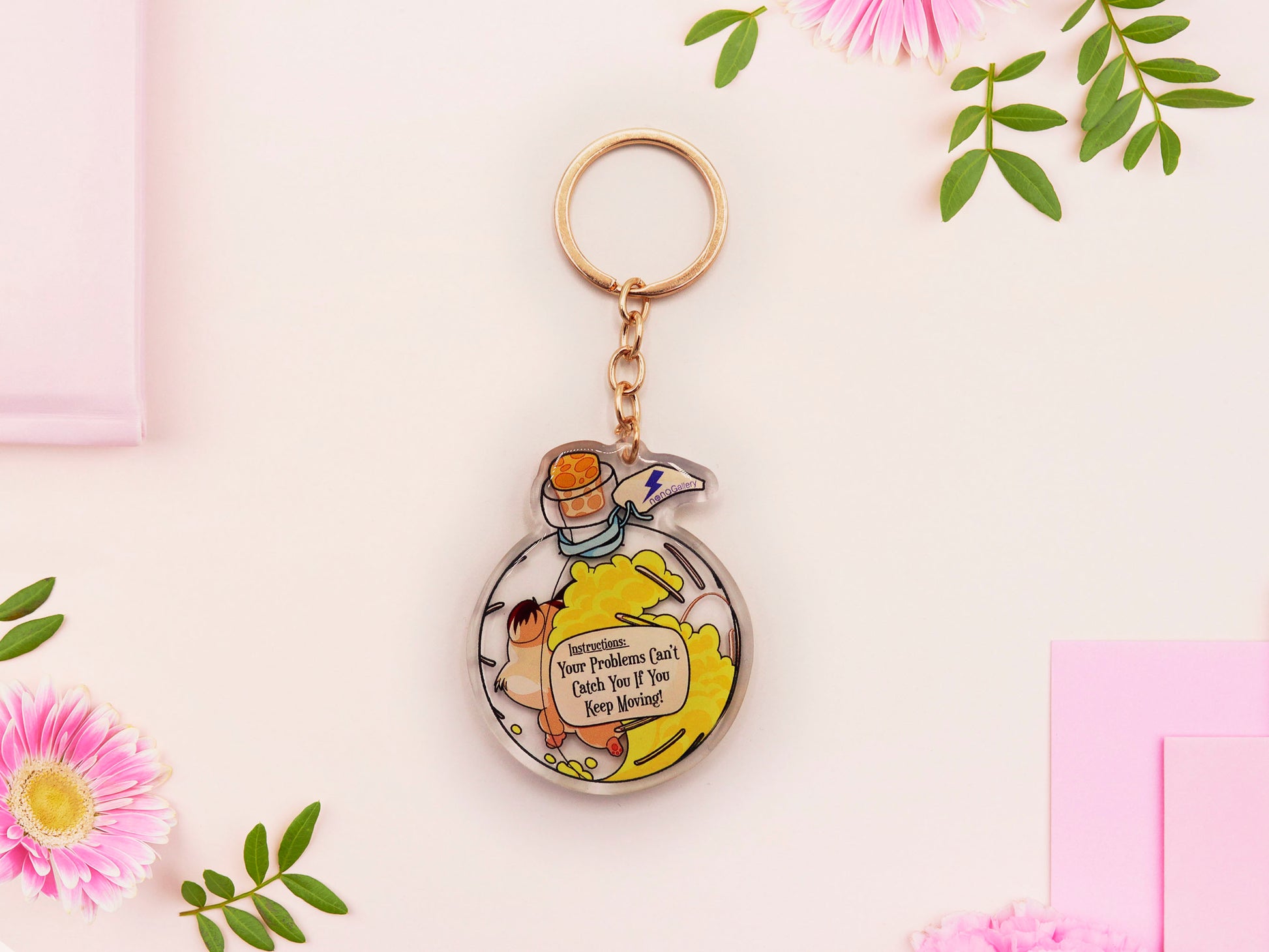 Double sided epoxy keychain with golden clasp of a happy Russian dwarf hamster running in a hamster ball shaped potion bottle labelled potion of speed