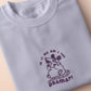 Purple embroidered cute design of a chibi screaming crying possum with the quote Is it me am I the drama?!