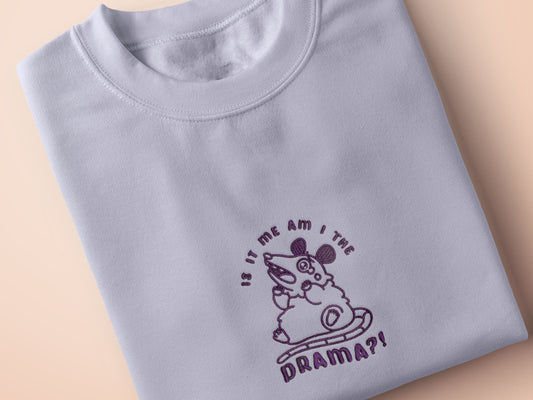 Purple embroidered cute design of a chibi screaming crying possum with the quote Is it me am I the drama?!