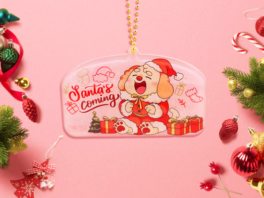 Acrylic epoxy christmas tree hanging decoration with a large acrylic charm of a cute cockapoo barley dog in a santa outfit surrounded by presents with the quoteSanta's coming