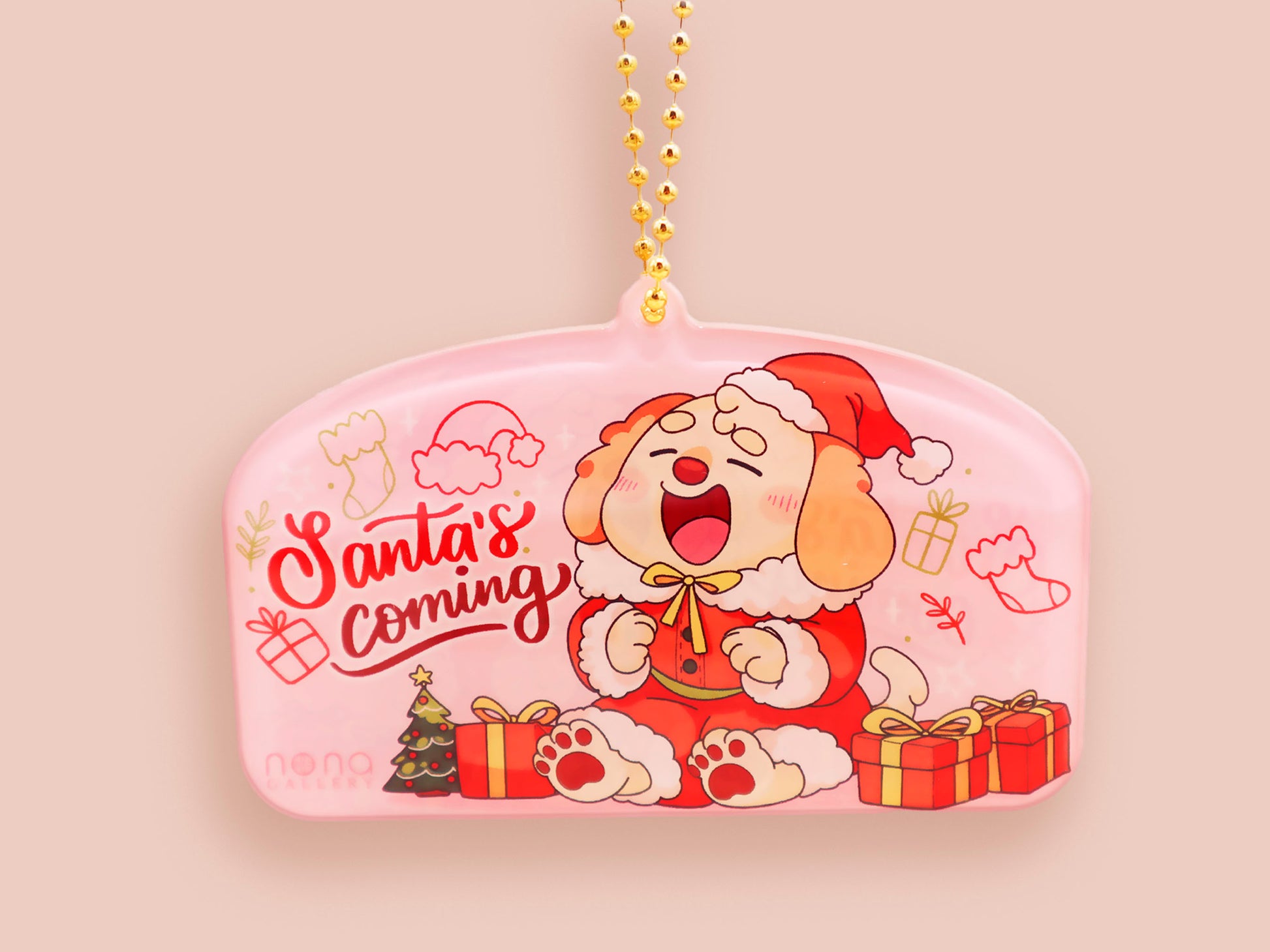 Acrylic epoxy christmas tree hanging decoration with a large acrylic charm of a cute cockapoo barley dog in a santa outfit surrounded by presents with the quoteSanta's coming