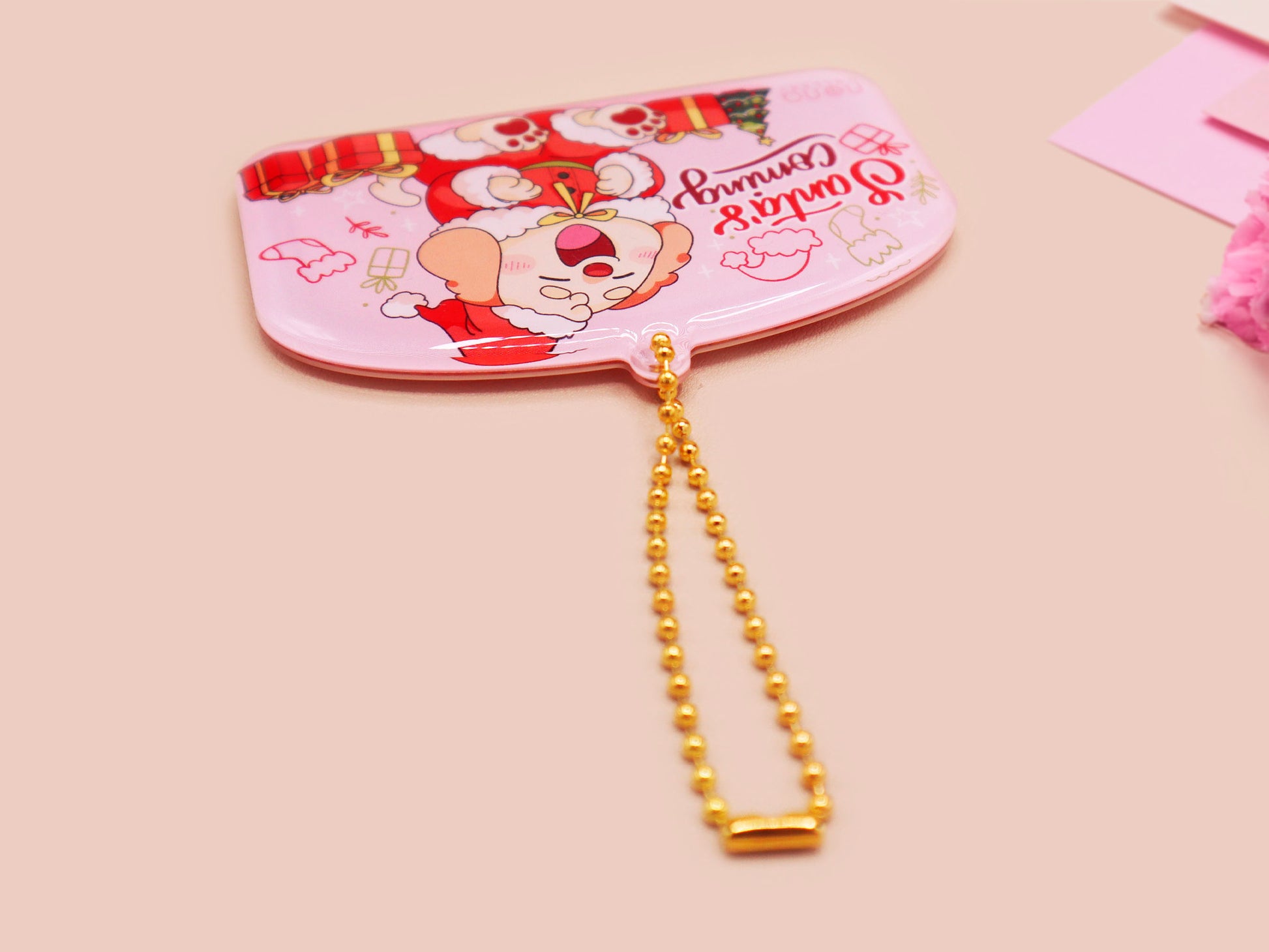 Acrylic epoxy christmas tree hanging decoration with a large acrylic charm of a cute cockapoo barley dog in a santa outfit surrounded by presents with the quoteSanta's coming