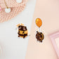 Two stickers of digital illustrated cartoon one is a fat bee sat down looking sad and crying with the words save me! and pleaszz. The other sticker is a sulking bee with a broken wing tied to an orange balloon.