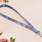 Cute full legth dark blue lanyard with a double sided cryptid monster and alien pattern and silver swivel hook clasp.