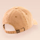 A vintage yellow baseball cap hat with an embroidered cute goose wearing a paper hat with the quote Silly Goose University