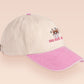Vintage style truckers baseball cap with a contrast cream and pink peak design with an embroidered cute hanster angry and sulking with the quote smol but angy
