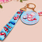 Acrylic epoxy shrimp keychain with a large acrylic charm of a a chef shrimp frying rice in a pan with the quote so you're telling me a shrimp fried this rice, a smaller charm of a cute baby shrimp and a matching blue shrimp lanyard.
