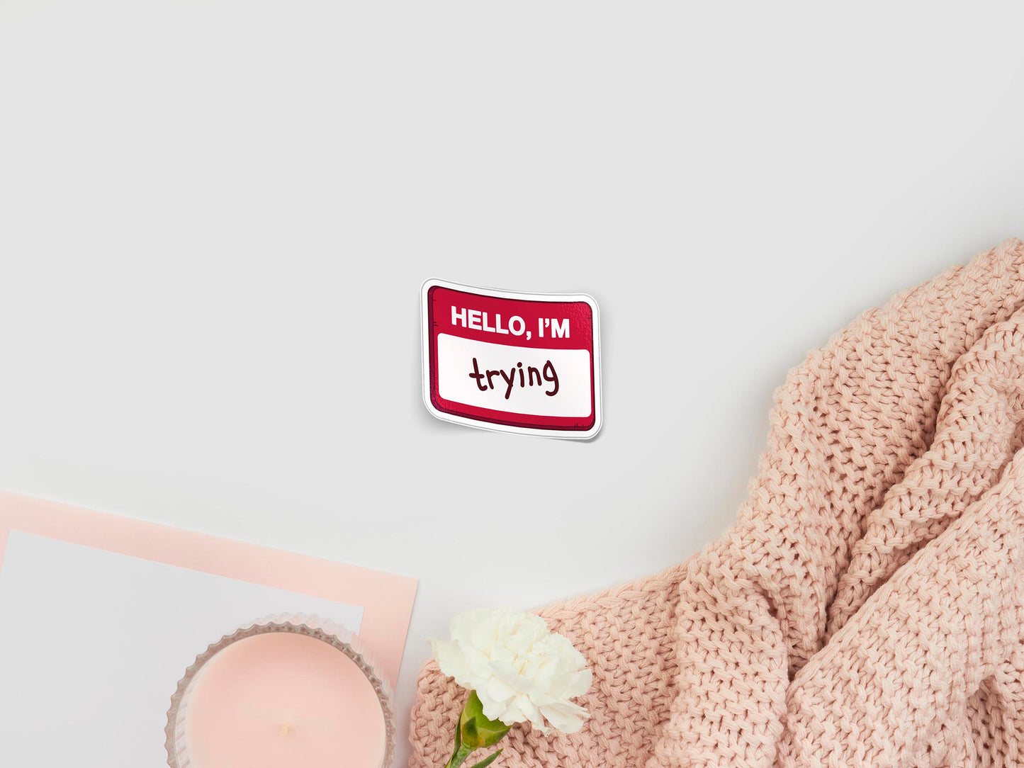 Large sticker of digital illustration cartoon of a funny Hello I'm red badge with the word trying written instead of a name