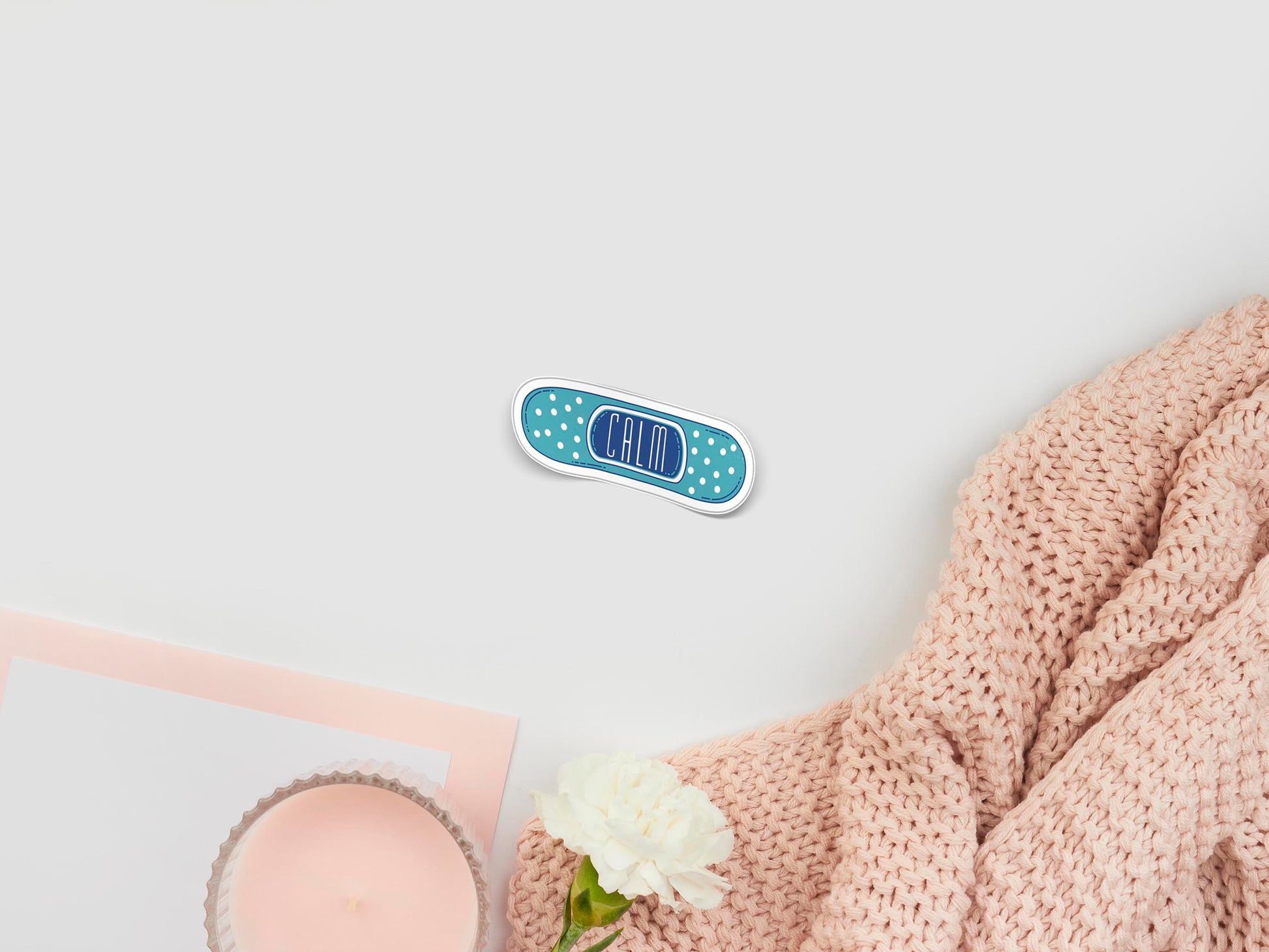 Large sticker of digital illustration cartoon of a blue plaster band aid with the word Calm written in the centre 