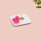 Clear acrylic pin badge with a pink heart-shaped rubber pin back clasp. The design of the pin badge is a cute chibi white cat skateboarding with the quote some people are just too cool but not me.