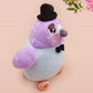 An adorable purple and blue pigeon bird plushie toy with cute embroidered eyes and facial expression, wearing a black top hat and bow tie, with a hang tag describing the pigeon as Susan.