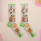 Cute knitted cotton crew socks with cute chibi Tabletop RPG Cryptid Monsters from DND such as Owlbears, Almiraj Rabbits, a Displacer Beast Kitten, Beholder, and Mimic chest