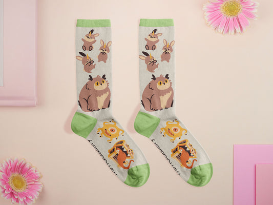 Cute knitted cotton crew socks with cute chibi Tabletop RPG Cryptid Monsters from DND such as Owlbears, Almiraj Rabbits, a Displacer Beast Kitten, Beholder, and Mimic chest