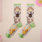 Cute knitted cotton crew socks with cute chibi Tabletop RPG Cryptid Monsters from DND such as Owlbears, Almiraj Rabbits, a Displacer Beast Kitten, Beholder, and Mimic chest