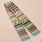 Cute knitted scarf with cute coloured Tabletop boardgame pieces such as meeple mahjong chess monopoly dice ludo and dominos