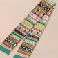 Cute knitted scarf with cute coloured Tabletop boardgame pieces such as meeple mahjong chess monopoly dice ludo and dominos