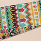 Cute knitted scarf with cute coloured Tabletop boardgame pieces such as meeple mahjong chess monopoly dice ludo and dominos