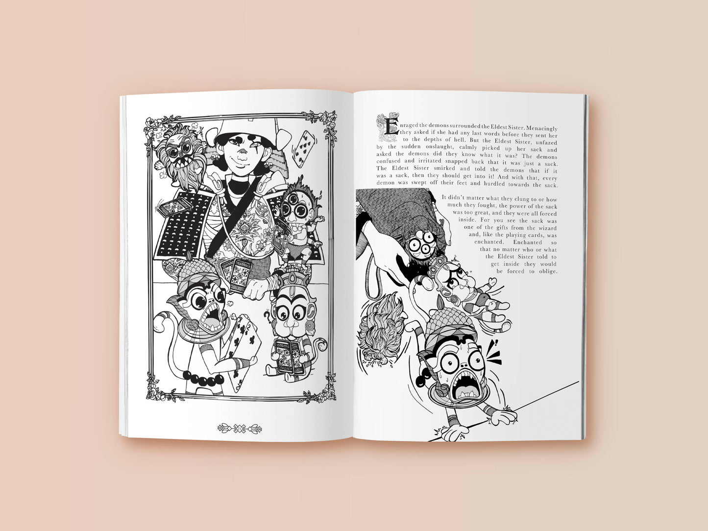 Interior pages of book showing text and a black and white cartoon drawing of a female samurai playing a card game with Indian yakshas and demons