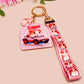 Cute pink keychain and lanyard of an adorable chibi hamster guinea pig in heart sunglasses driving a little pink car with the quote the Horrors do be persisting, with matching mini charm and lanyard of multiple cute fat guinea pig hamsters