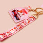 Cute pink keychain and lanyard of an adorable chibi hamster guinea pig in heart sunglasses driving a little pink car with the quote the Horrors do be persisting, with matching mini charm and lanyard of multiple cute fat guinea pig hamsters