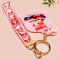 Cute pink keychain and lanyard of an adorable chibi hamster guinea pig in heart sunglasses driving a little pink car with the quote the Horrors do be persisting, with matching mini charm and lanyard of multiple cute fat guinea pig hamsters