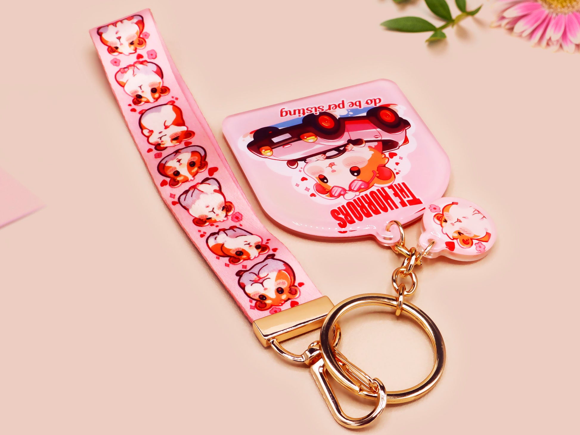 Cute pink keychain and lanyard of an adorable chibi hamster guinea pig in heart sunglasses driving a little pink car with the quote the Horrors do be persisting, with matching mini charm and lanyard of multiple cute fat guinea pig hamsters