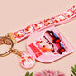 Cute pink keychain and lanyard of an adorable chibi hamster guinea pig in heart sunglasses driving a little pink car with the quote the Horrors do be persisting, with matching mini charm and lanyard of multiple cute fat guinea pig hamsters