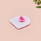 Clear acrylic pin badge with a pink heart-shaped rubber pin back clasp. The design of the pin badge is a cute chibi guinea pig hamster driving a pink car and the quote the horrors do be persisting.