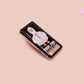 A black acrylic pin badge with a pink heart-shaped pin back clasp. The design of the pin badge is of a cute goose in a shirt and tie with the quote Time For Serious Goose