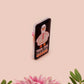 A black acrylic pin badge with a pink heart-shaped pin back clasp. The design of the pin badge is of a cute goose in a shirt and tie with the quote Time For Serious Goose