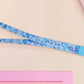 Cute full legth blue lanyard with a double sided underwater fish pattern and silver swivel hook clasp.