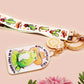 Acrylic epoxy cowboy frog keychain with a large acrylic charm of a cute cowboy frog wearing a stetson hat with the quote well actually this is my first rodeo, a smaller charm of a cute sherrifs badge and a matching cactus and cowboy boots and hats lanyard.