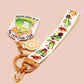 Acrylic epoxy cowboy frog keychain with a large acrylic charm of a cute cowboy frog wearing a stetson hat with the quote well actually this is my first rodeo, a smaller charm of a cute sherrifs badge and a matching cactus and cowboy boots and hats lanyard.