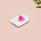 Clear acrylic pin badge with a pink heart-shaped rubber pin back clasp. The design of the pin badge is a cute chibi frog wearing a cowboy hat stetson and the quote well actually this is my first rodeo.