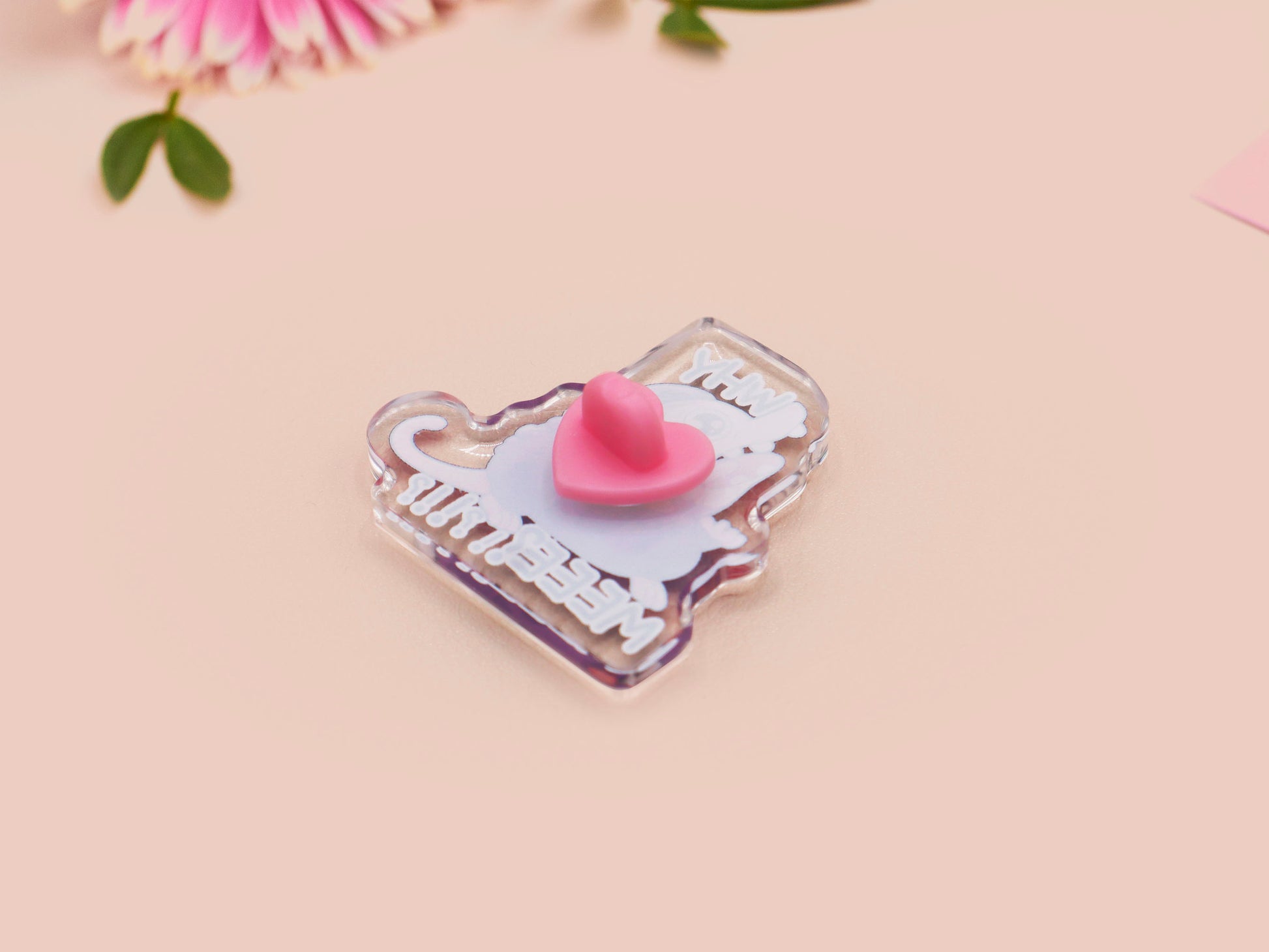 A clear acrylic pin badge with a heart-shaped pin rubber pin back clasp. The design of the pin badge is a cute cartoon screaming possum with the quote why me?!