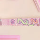 Cute full legth pink lanyard with a double sided funny worm on a string pattern and silver swivel hook clasp.