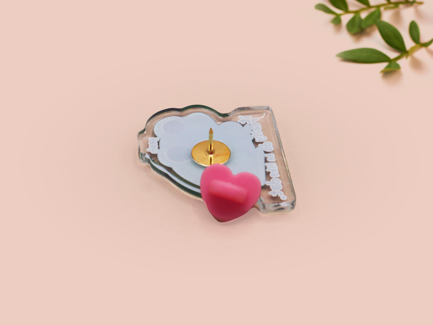 Clear acrylic pin badge with a pink heart-shaped rubber pin back clasp. The design of the pin badge is a cute cartoon stressed frog with the quote yeah it really do be like dat.