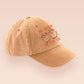 A vintage yellow baseball cap hat with an embroidered cute chibi sheep with the quote you either catan or you catan't