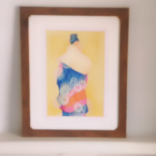 Video of brown framed oil painting with white frame mount. The painting itself is of a woman facing away wearing a blue iris kimono.