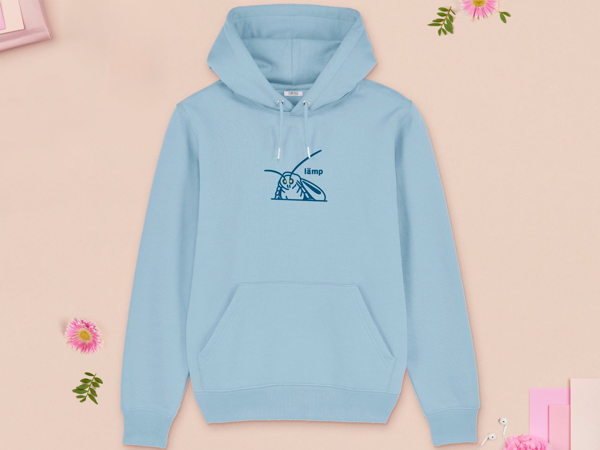 A blue long sleeve fleece hoodie, with an embroidered blue thread design of a moth with glowing yellow eyes and the word lämp