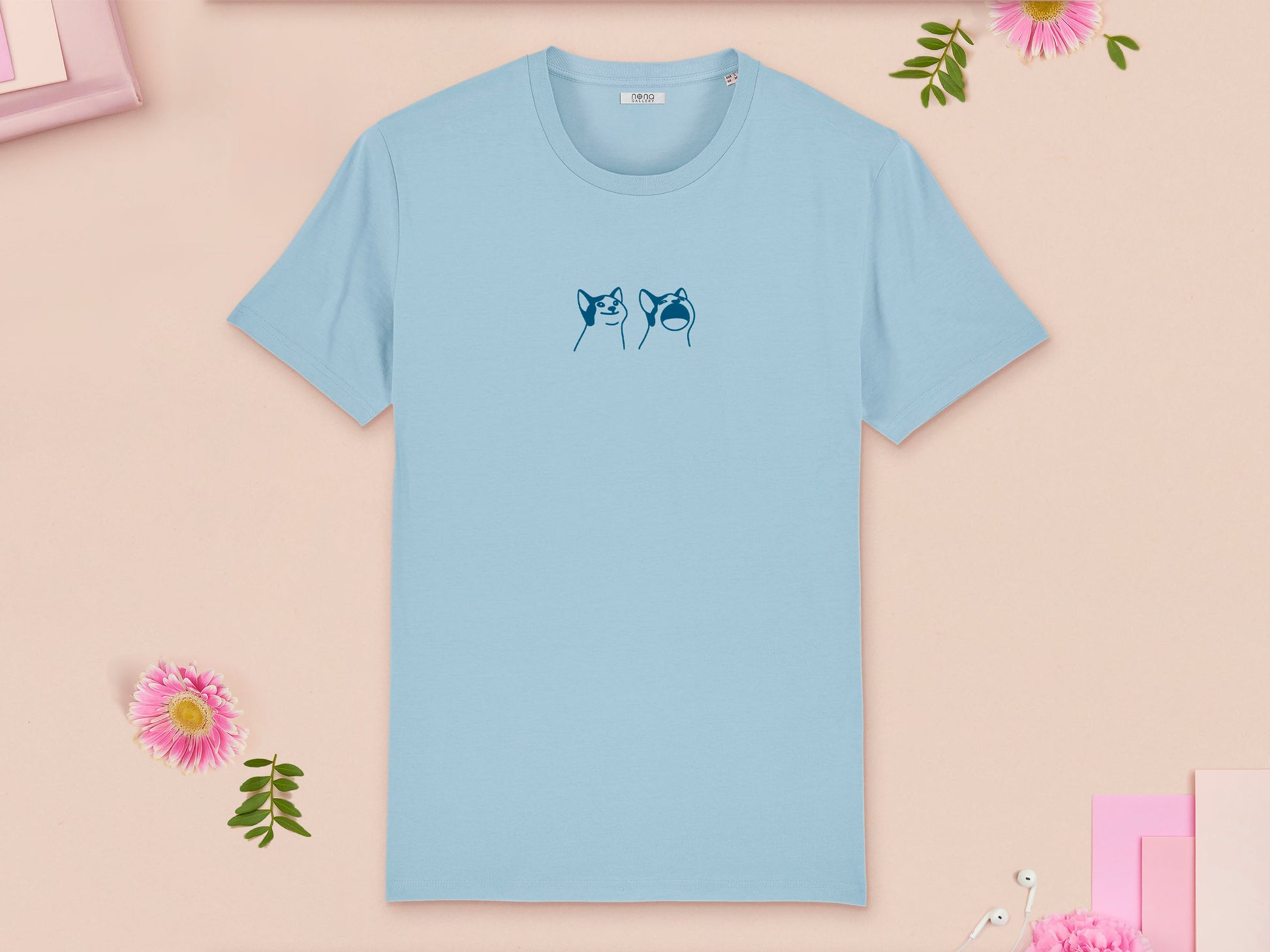A blue  crew neck short sleeve t-shirt, with an embroidered blue thread design of a cute popcat the cat meme reaction twitch emote