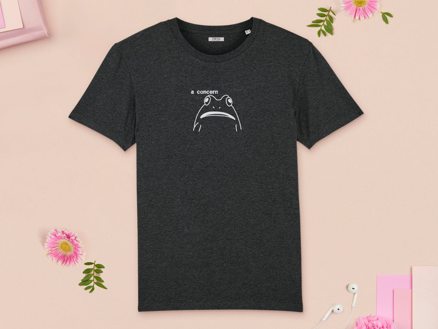 A grey  crew neck short sleeve t-shirt, with an embroidered white thread design of cute confused looking frog with the text a concern.