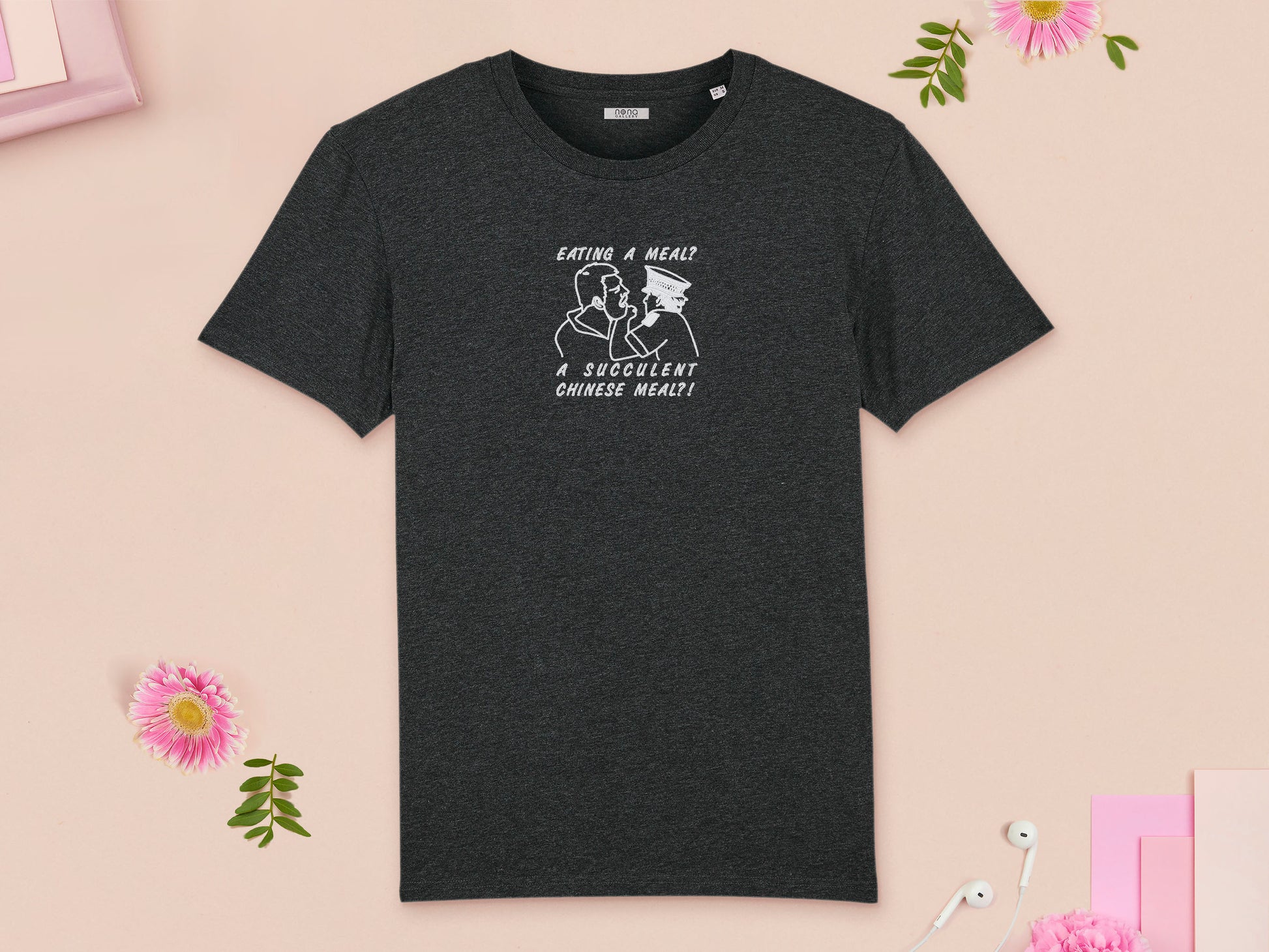 A grey crew neck short sleeve t-shirt, with an embroidered white thread design of the viral democracy manifest video of Charles Dozsa being arrested by a policeman with the text reading Eating A Meal? A Succulent Chinese Meal?!