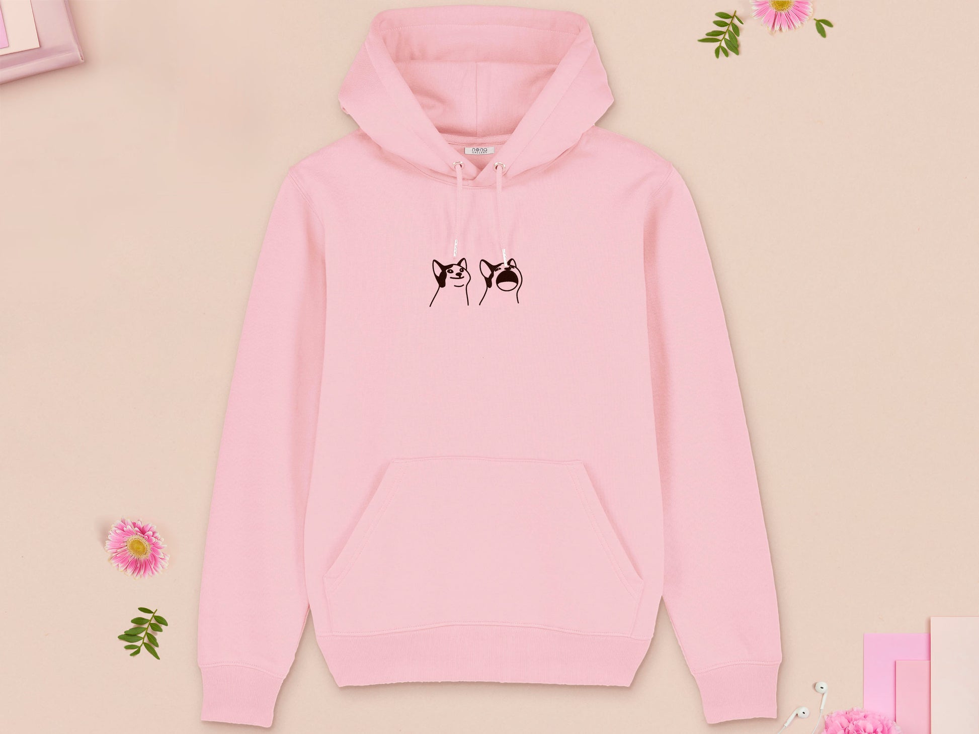 A pink long sleeved fleece hoodie, with an embroidered brown thread design of a cute popcat the cat meme reaction twitch emote