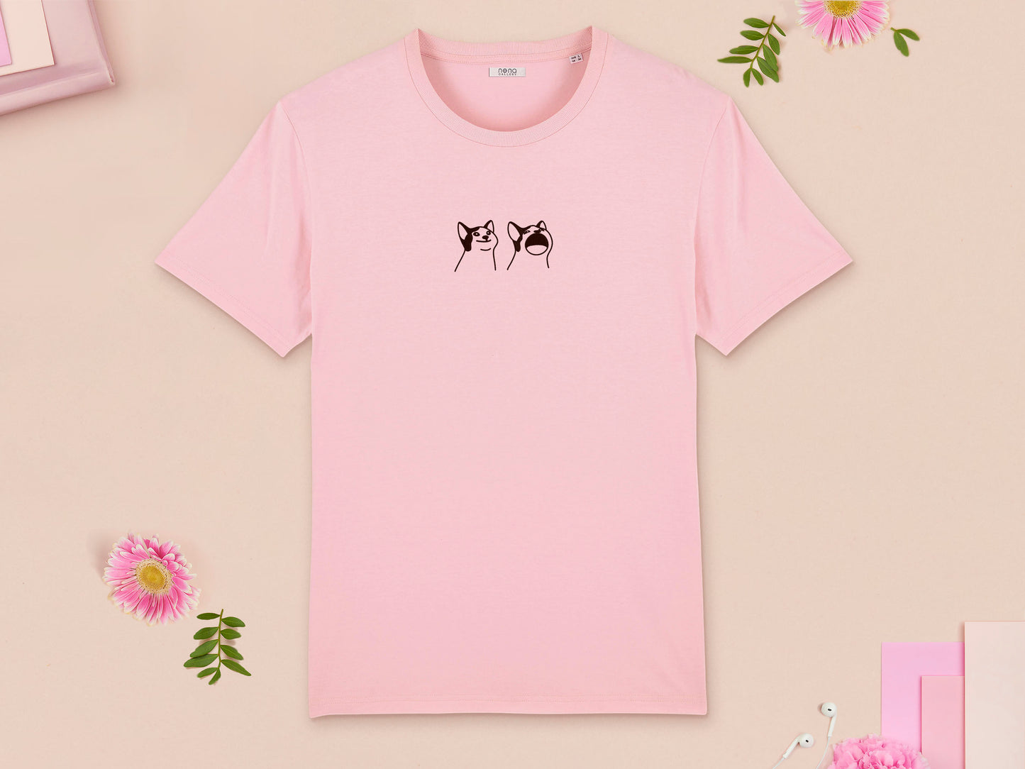 A pink crew neck short sleeve t-shirt, with an embroidered brown thread design of a cute popcat the cat meme reaction twitch emote